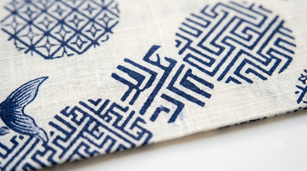 Close-up of premium 100% Japanese cotton yukata fabric showing fine weave texture in indigo and white geometric pattern