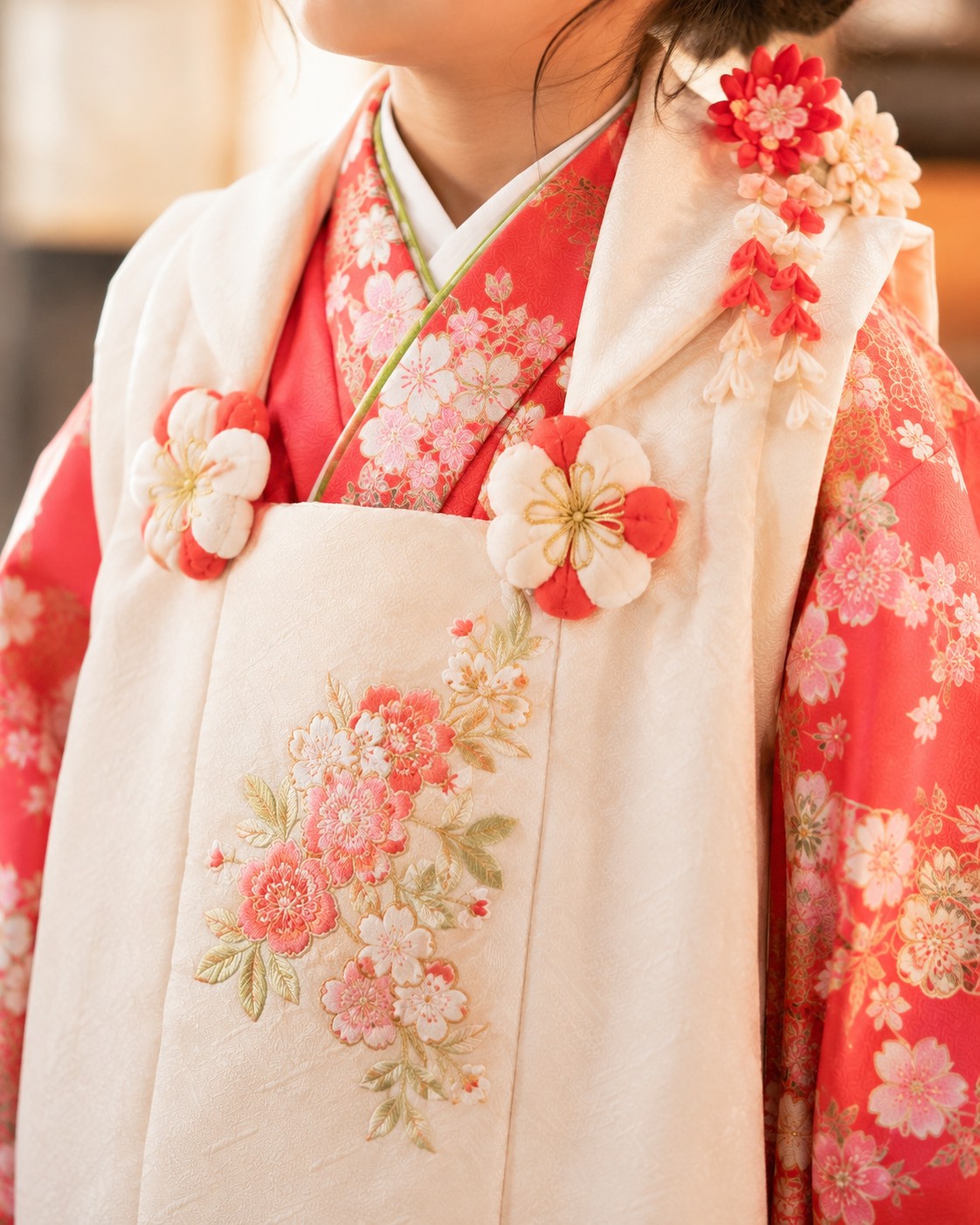 Close-up of a child's hifu overlay worn over a red kimono for Shichi-Go-San at age three