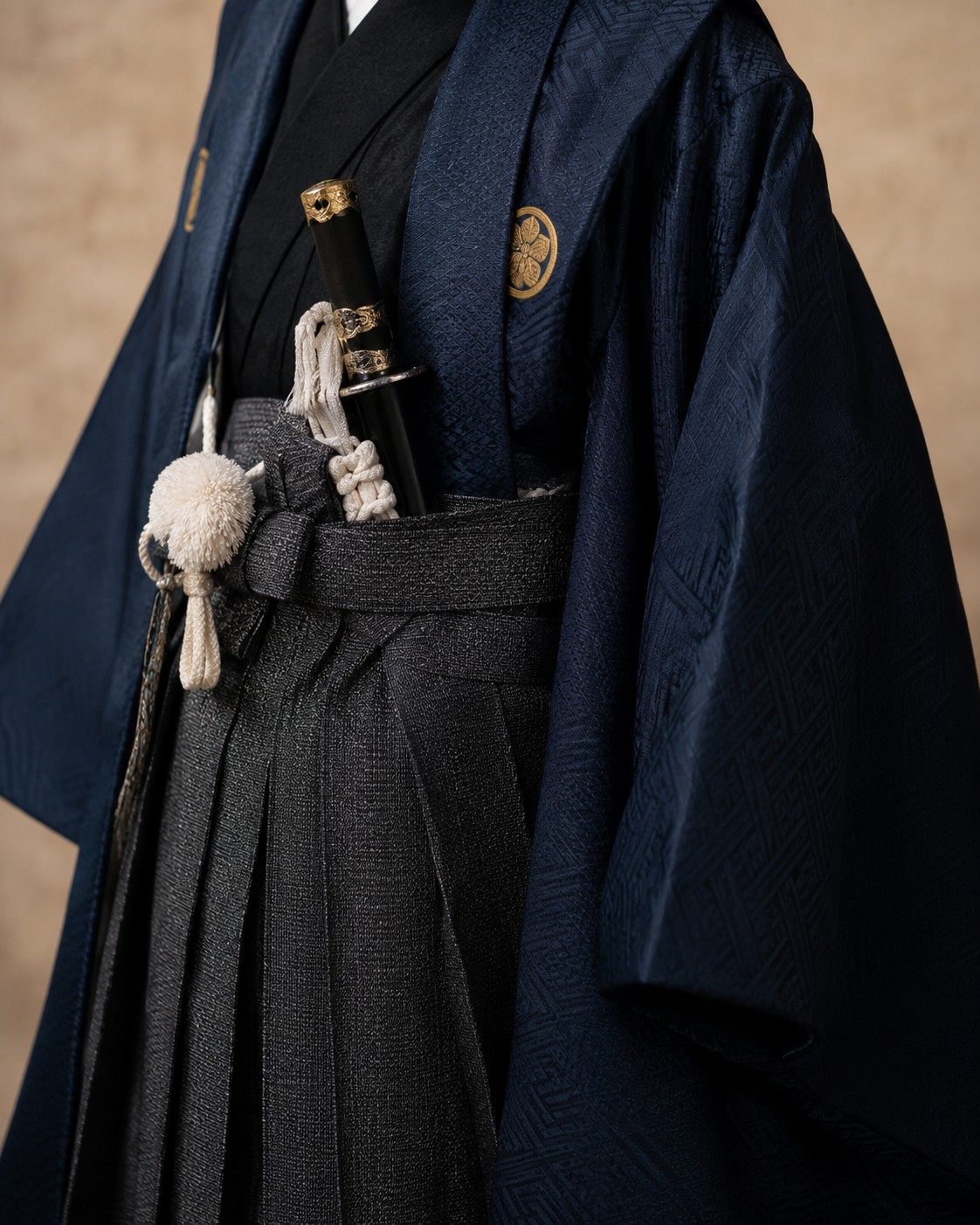 Detail of a boy's haori jacket and hakama with a decorative sword accessory for Shichi-Go-San at age five